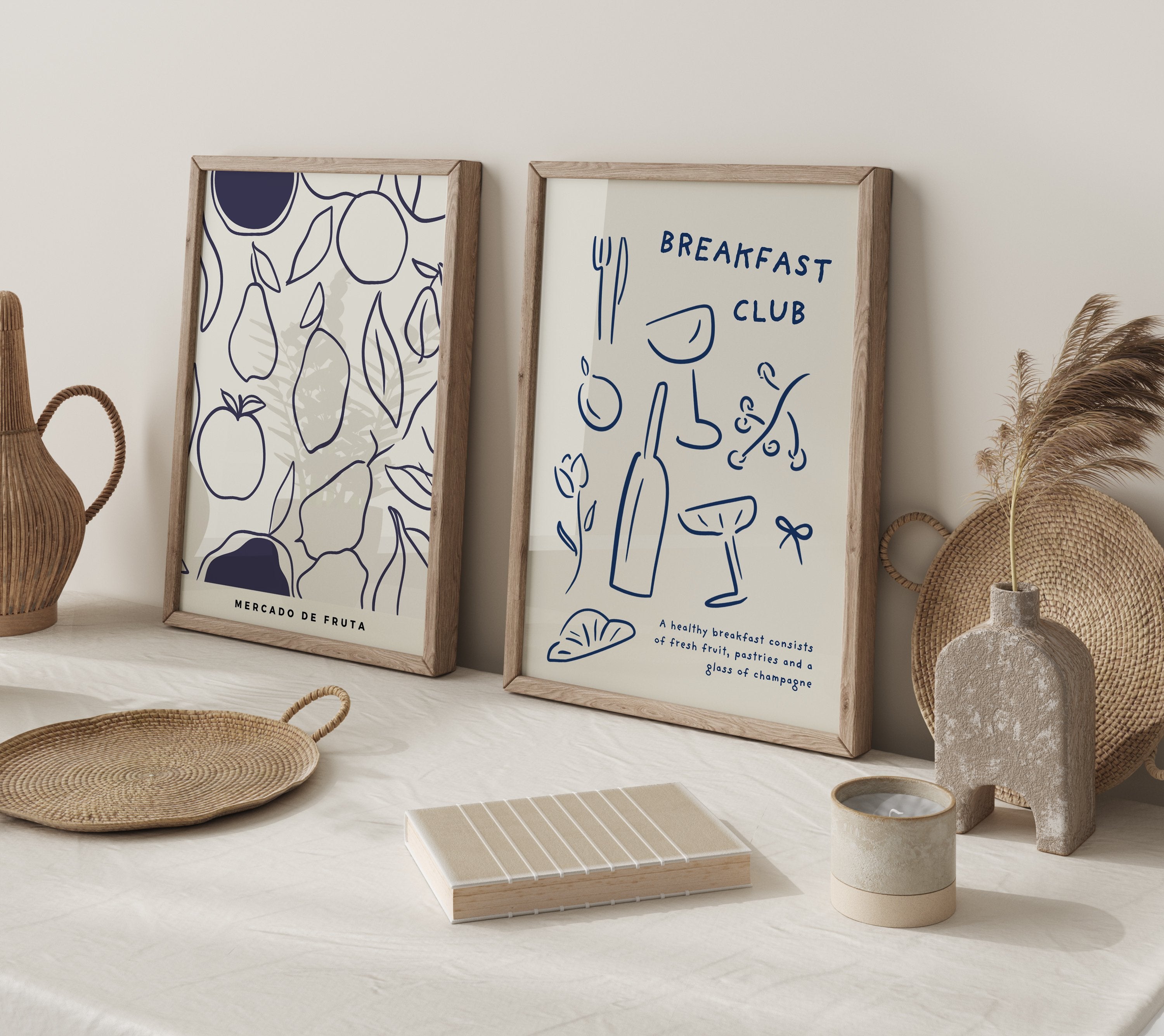 Minimalist trending framed prints leaning against a kitchen wall surrounded by decorative items.