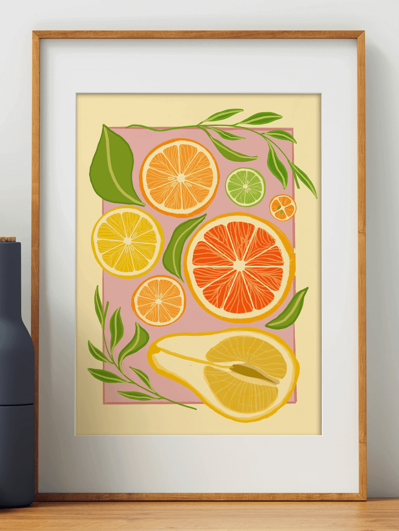 Citrus fruits poster featuring fruits in vibrant pink, yellow and orange colours displayed in a wooden frame.