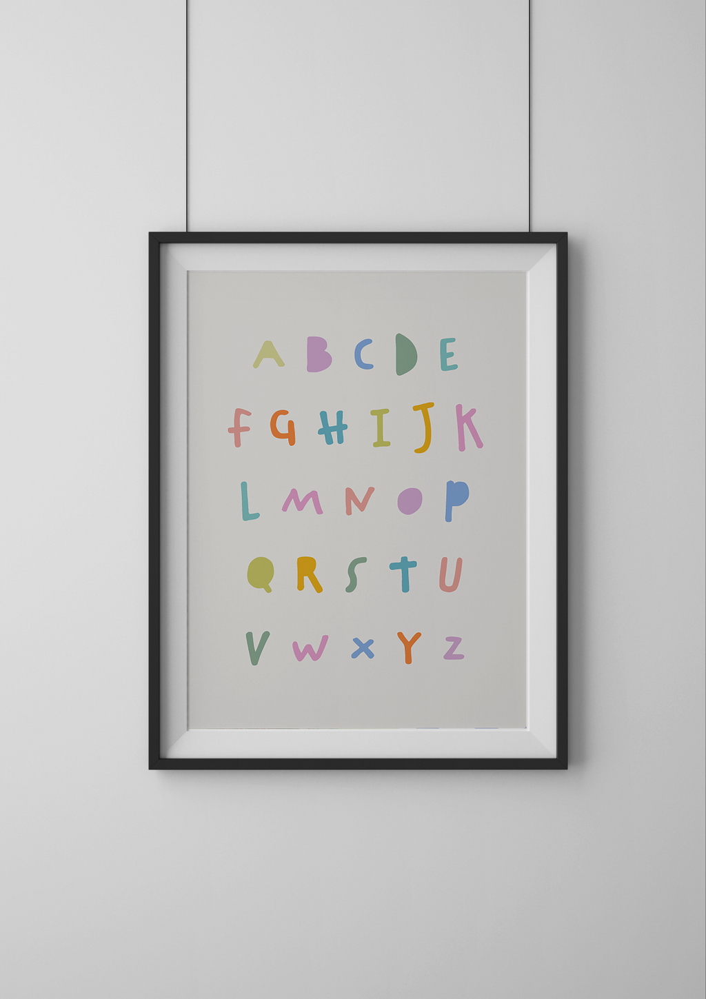 Framed alphabet poster with colorful letters on a light gray background