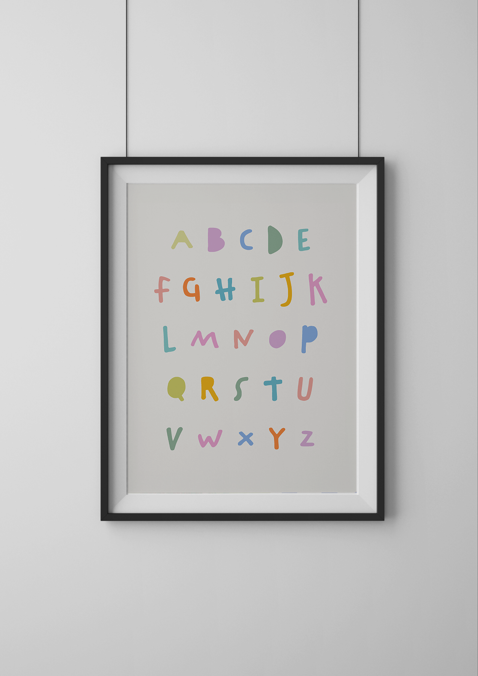 Framed alphabet poster with colorful letters on a light gray background