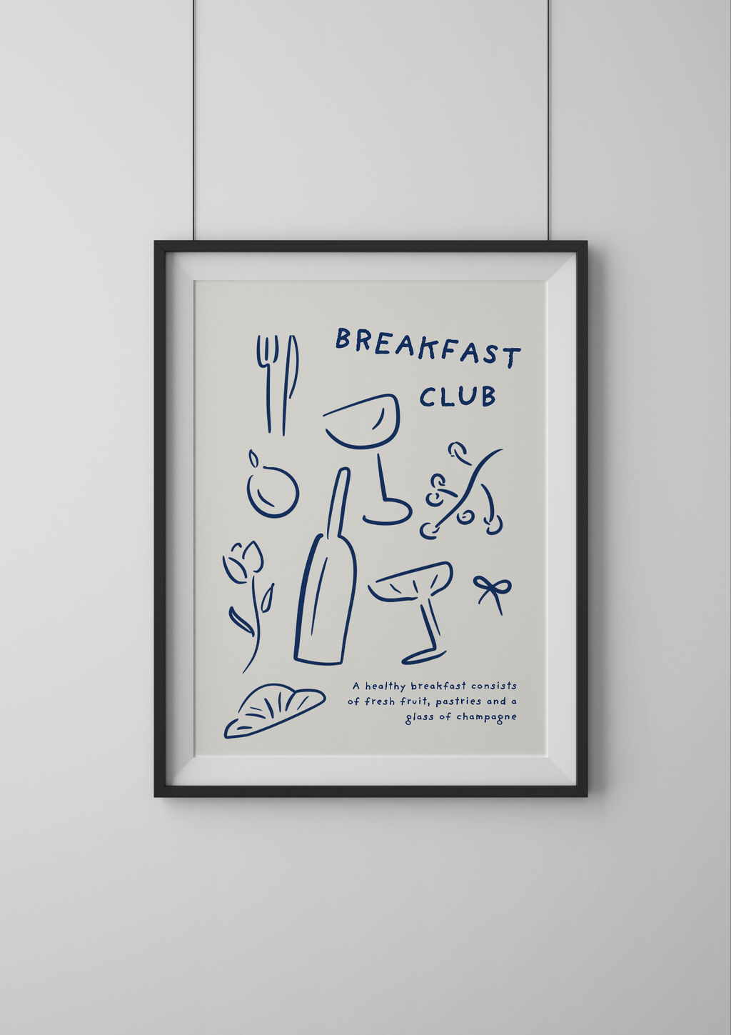 Framed artwork with 'Breakfast Club' text and illustrations on a light background