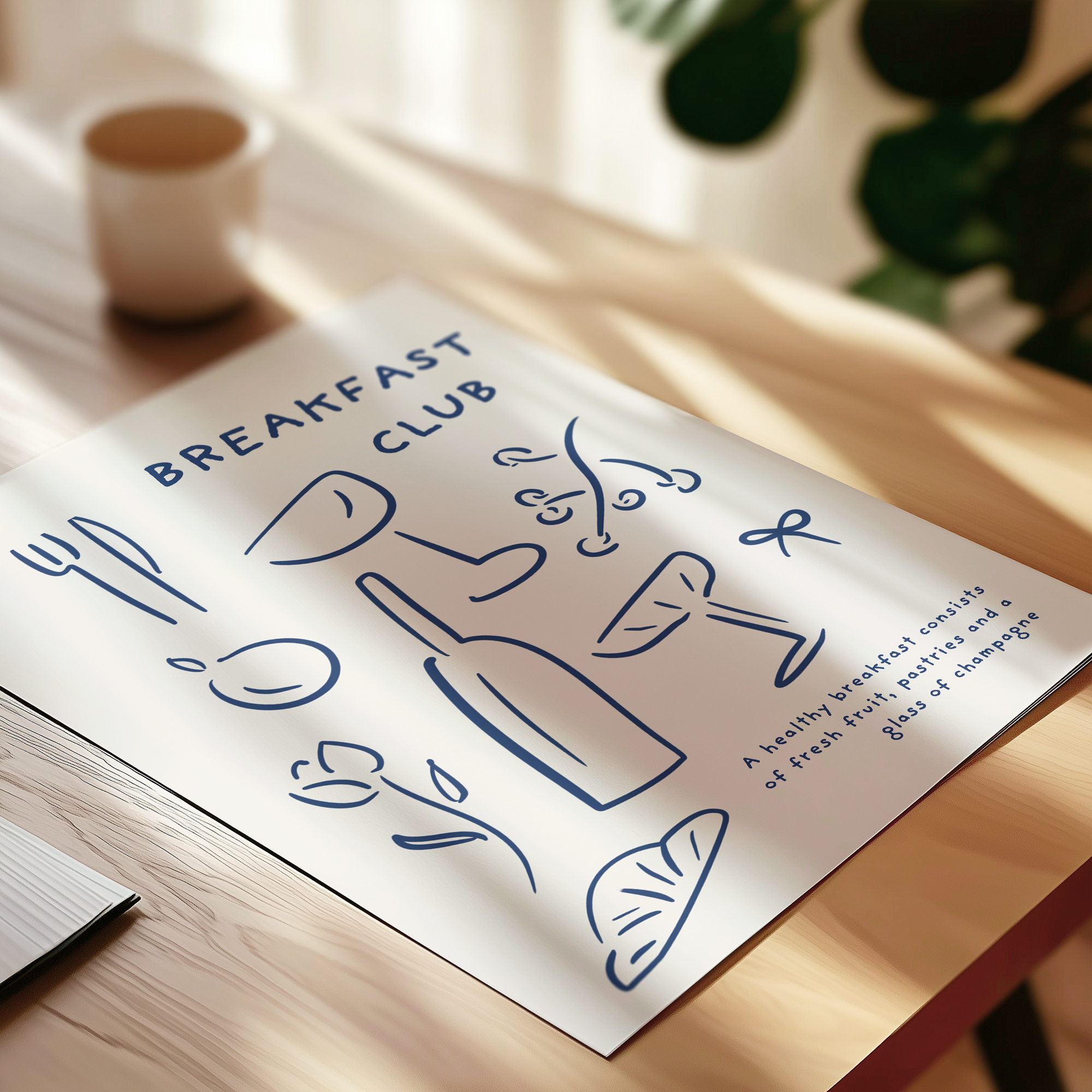 Sheet of paper with 'Breakfast Club' design on a wooden surface.