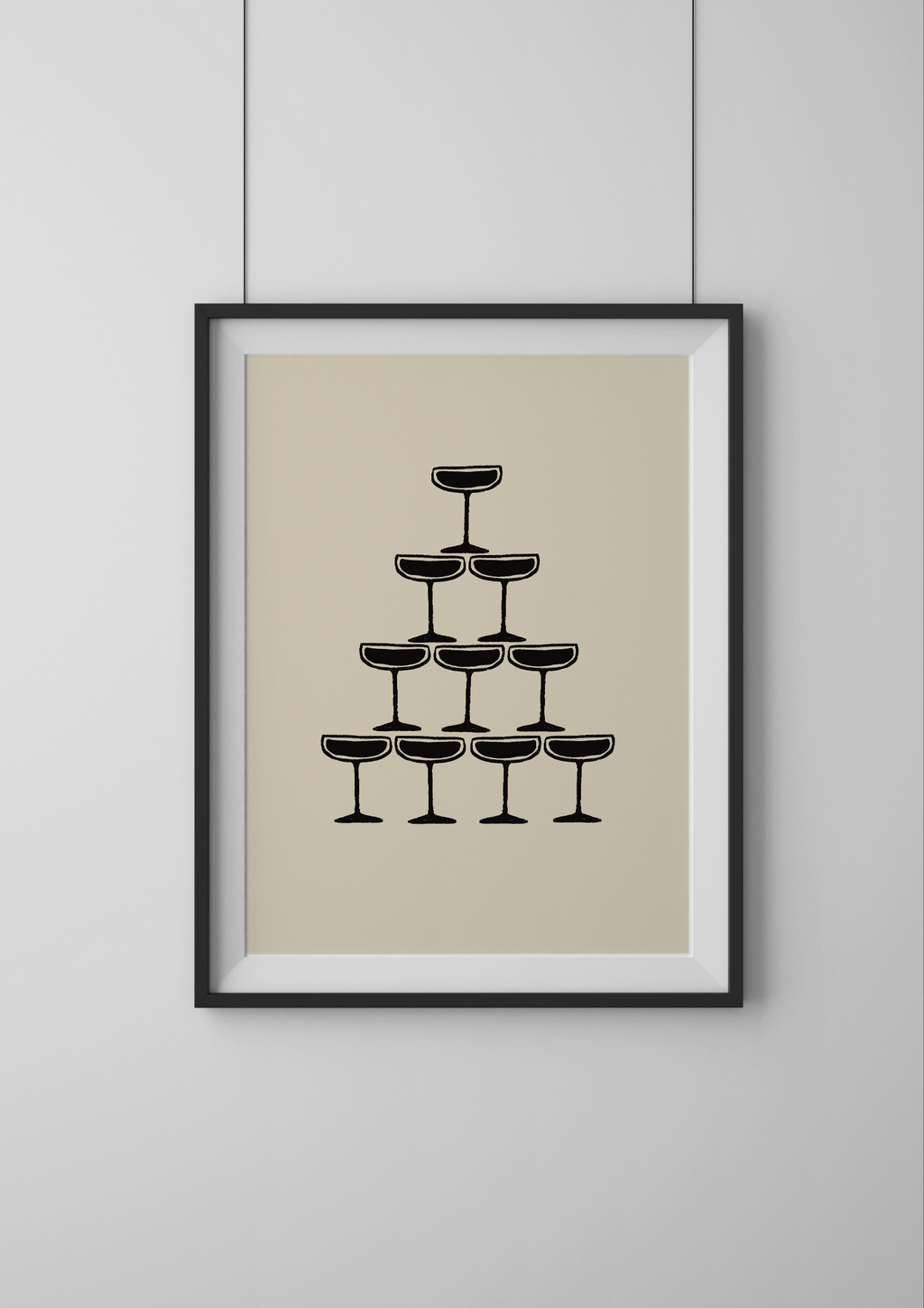 Framed artwork of a pyramid of black wine glasses on a beige background