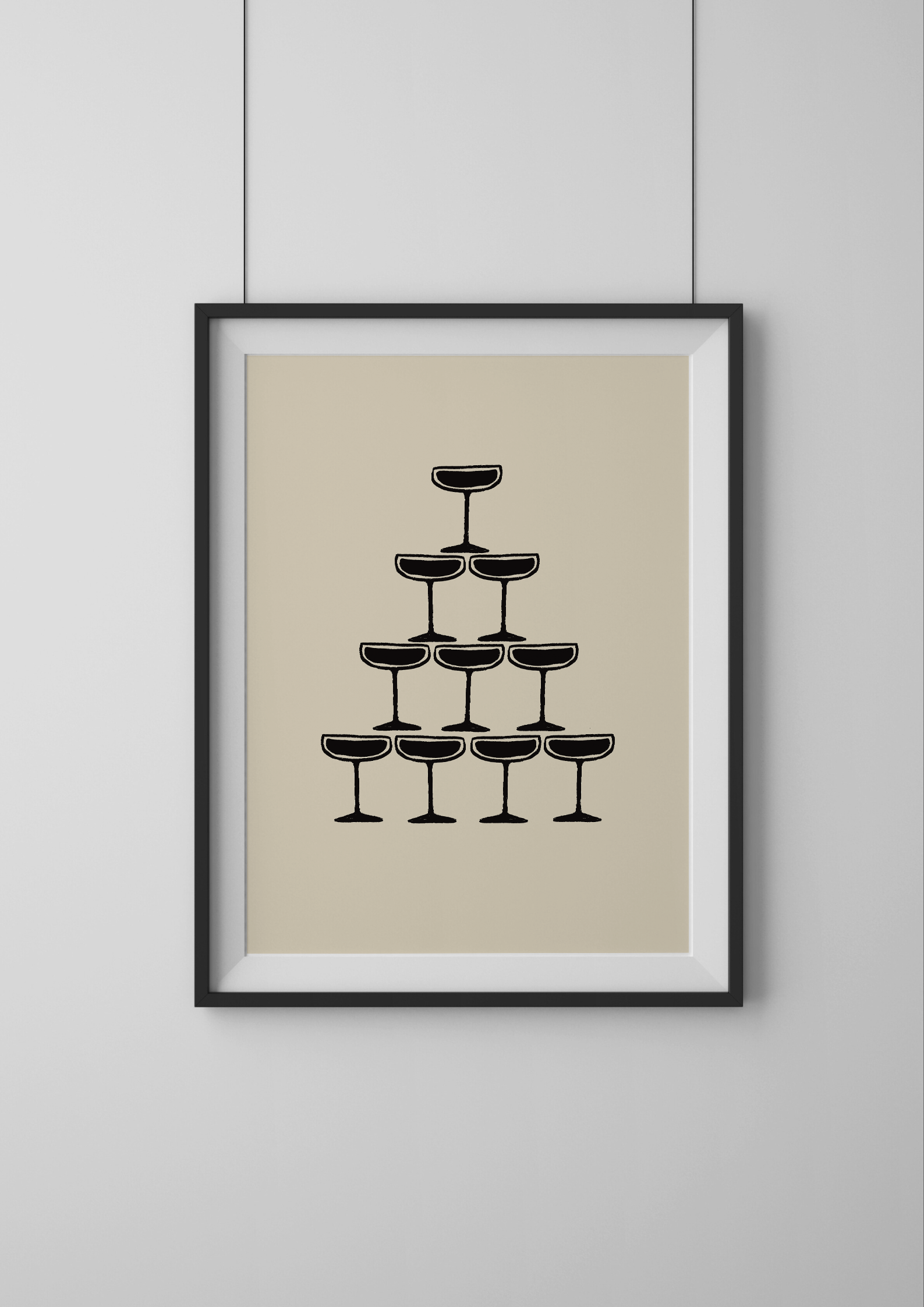 Framed artwork of a pyramid of black wine glasses on a beige background