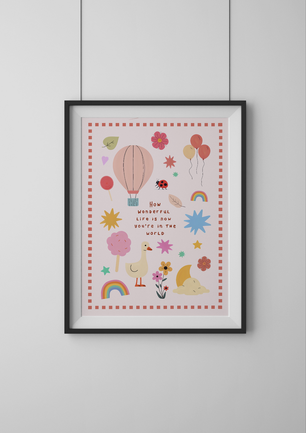 Framed children's poster with colorful illustrations and text on a white wall.