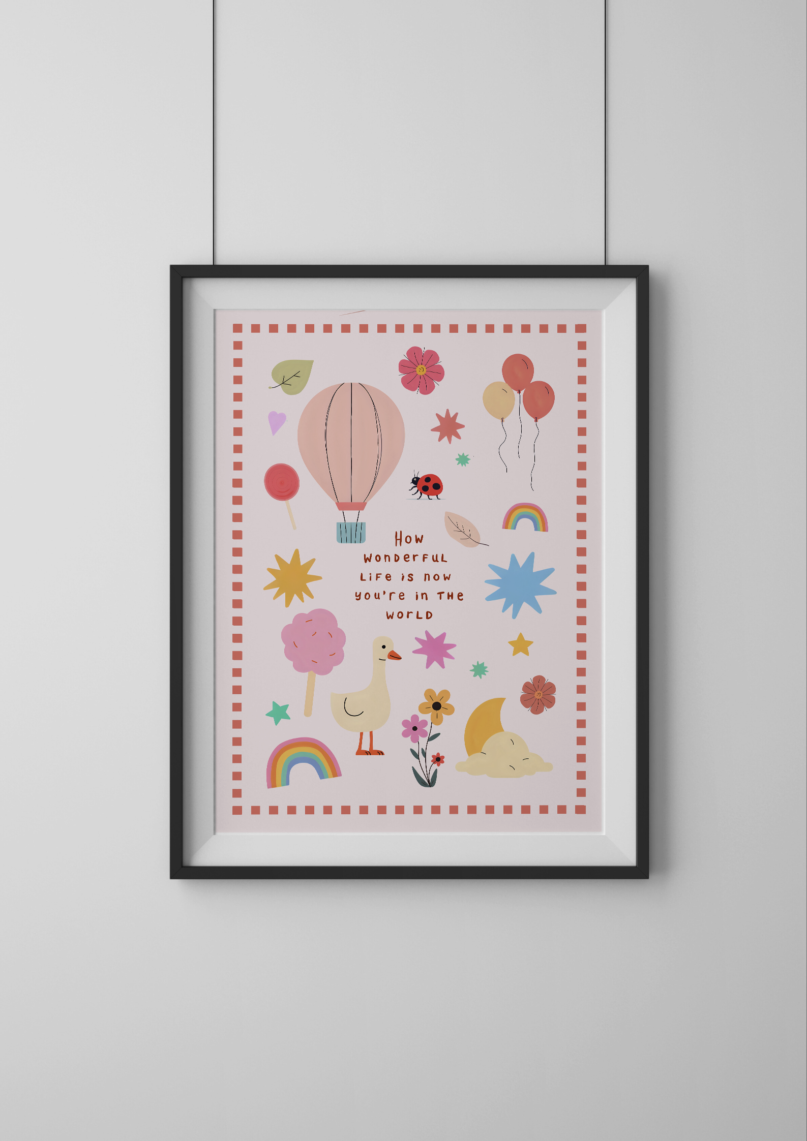 Framed children's poster with colorful illustrations and text on a white wall.