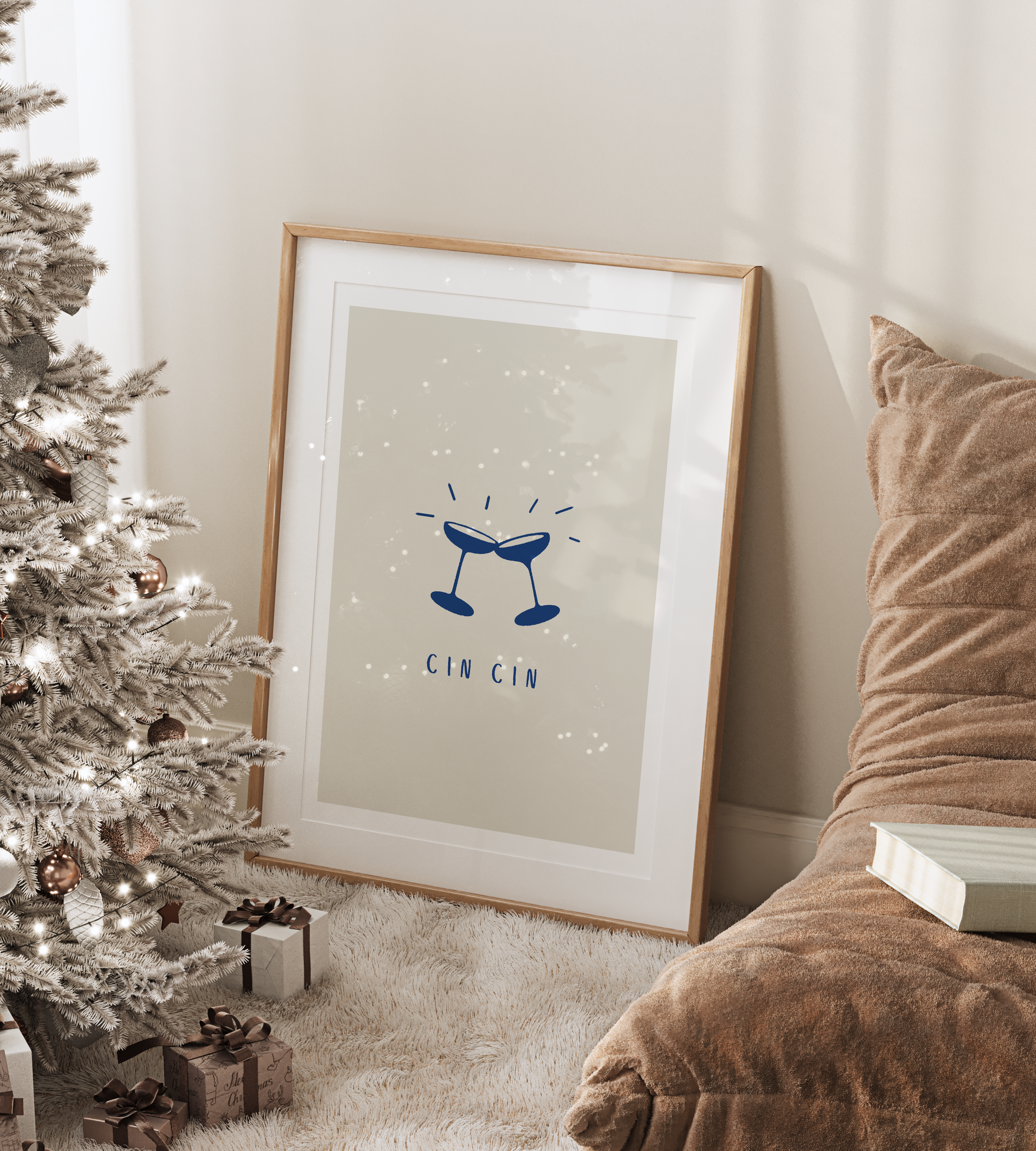 Framed kitchen print featuring "cin cin" alcohol illustration against beige background and white border. Displayed in a wooden frame in neutral decor with faux fur rug and Christmas tree.