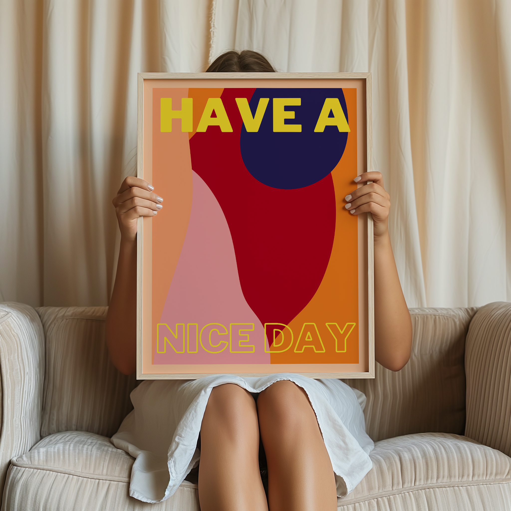 Person holding a colorful framed poster with 'HAVE A NICE DAY' text.