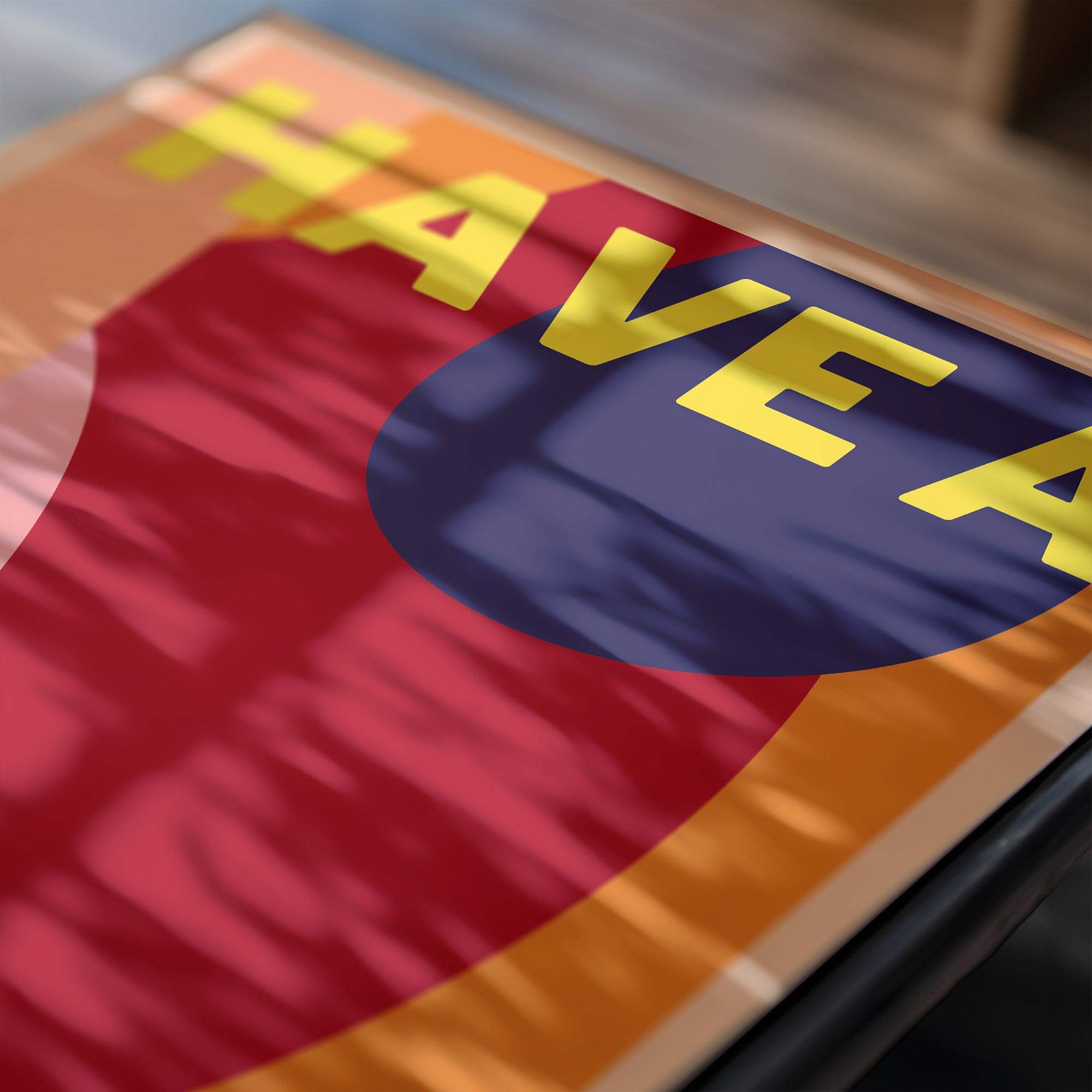 Close-up of a colorful art print with text and logo