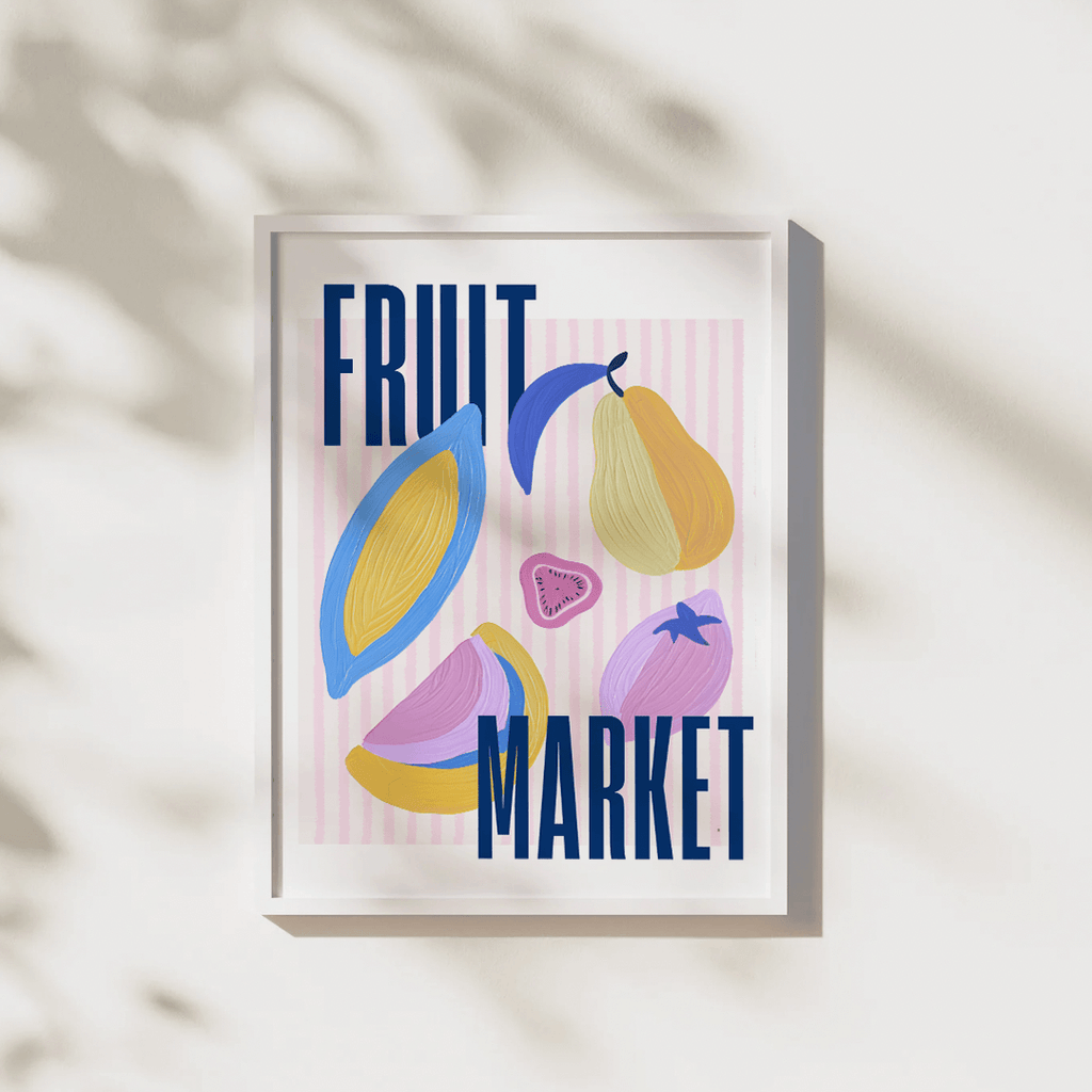 Framed artwork with colorful fruit illustrations and 'Fruit Market' text on a light background