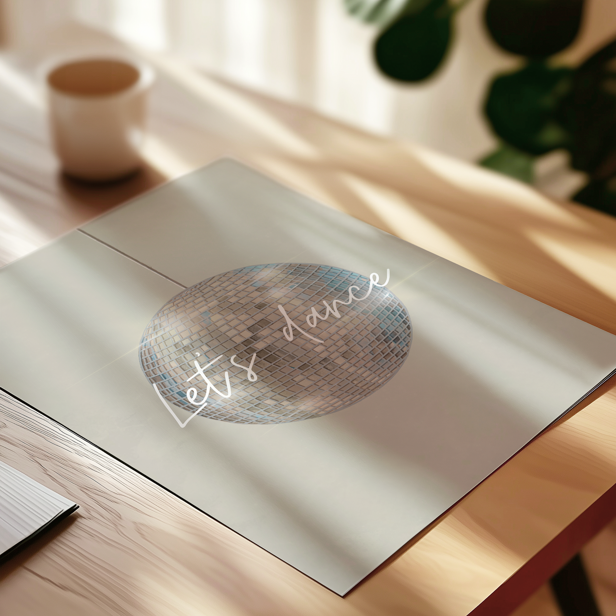 Decorative print with 'Let's Dance' text on a wooden surface