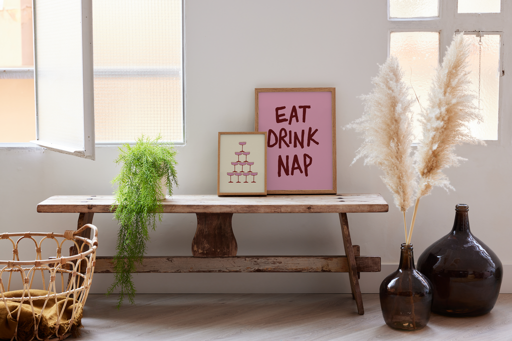 Living room with wooden bench, decorative vases, and framed signs.