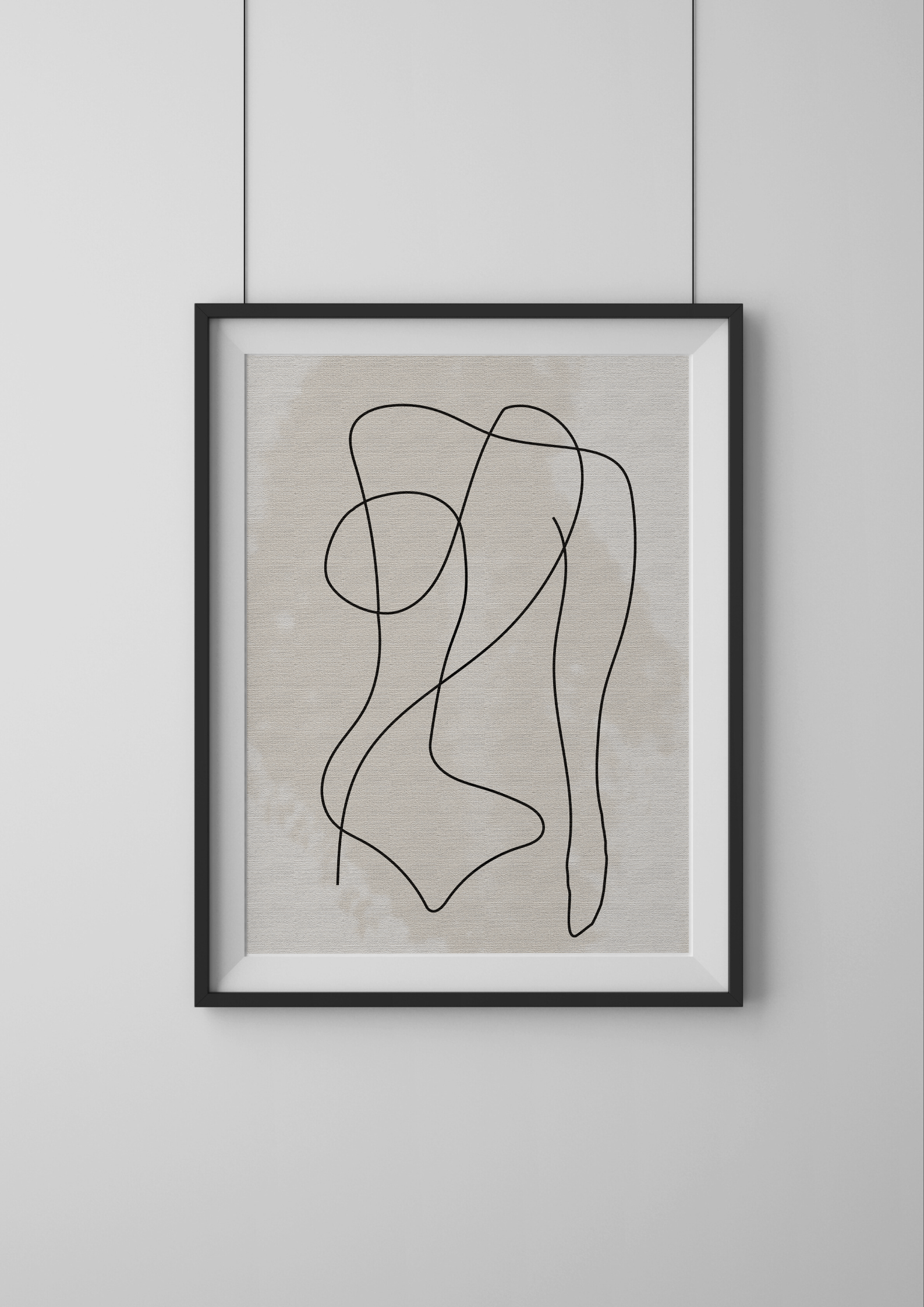 Framed abstract line art on a light gray wall