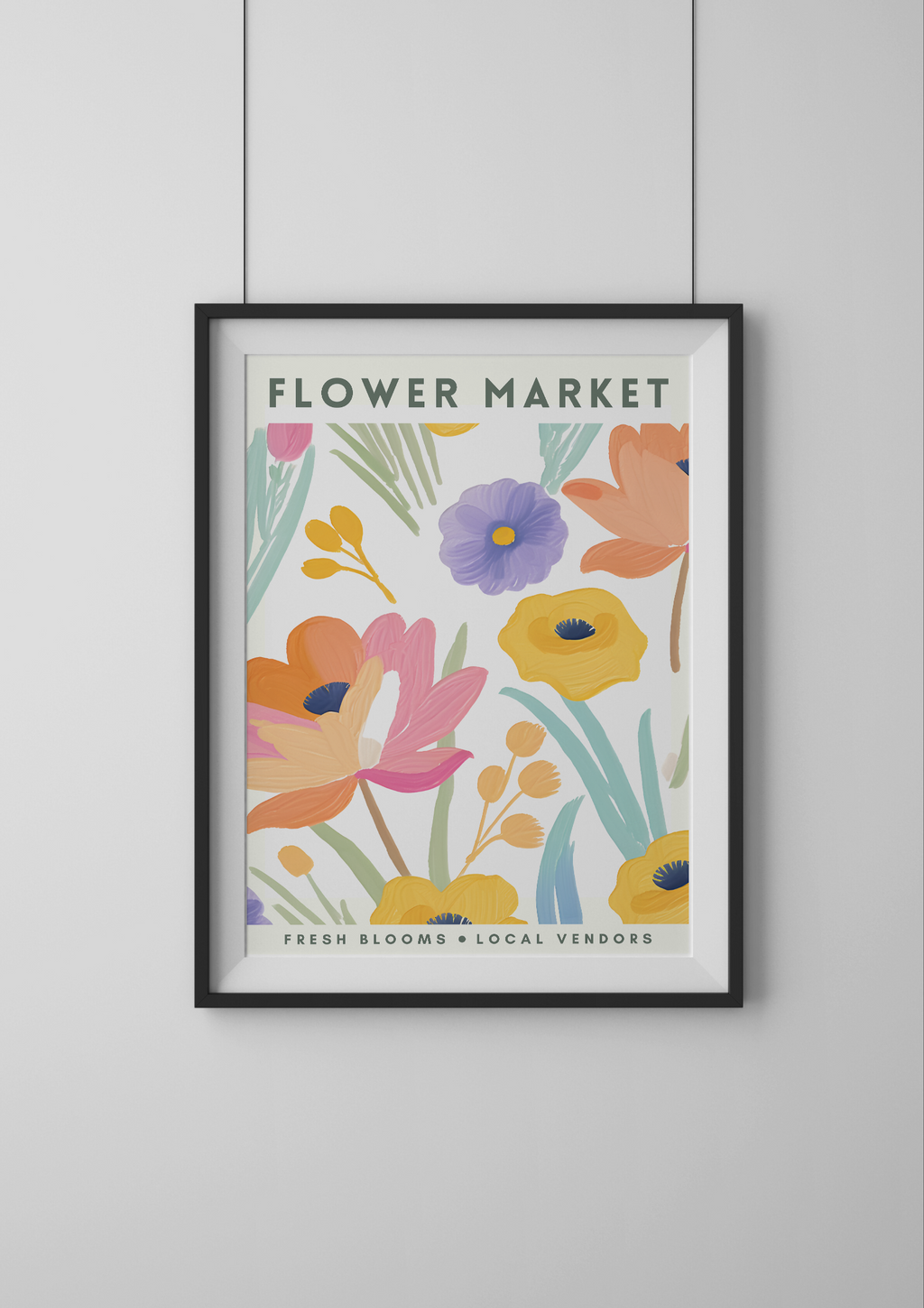 Framed artwork with colorful floral design and 'Flower Market' text on a white wall.