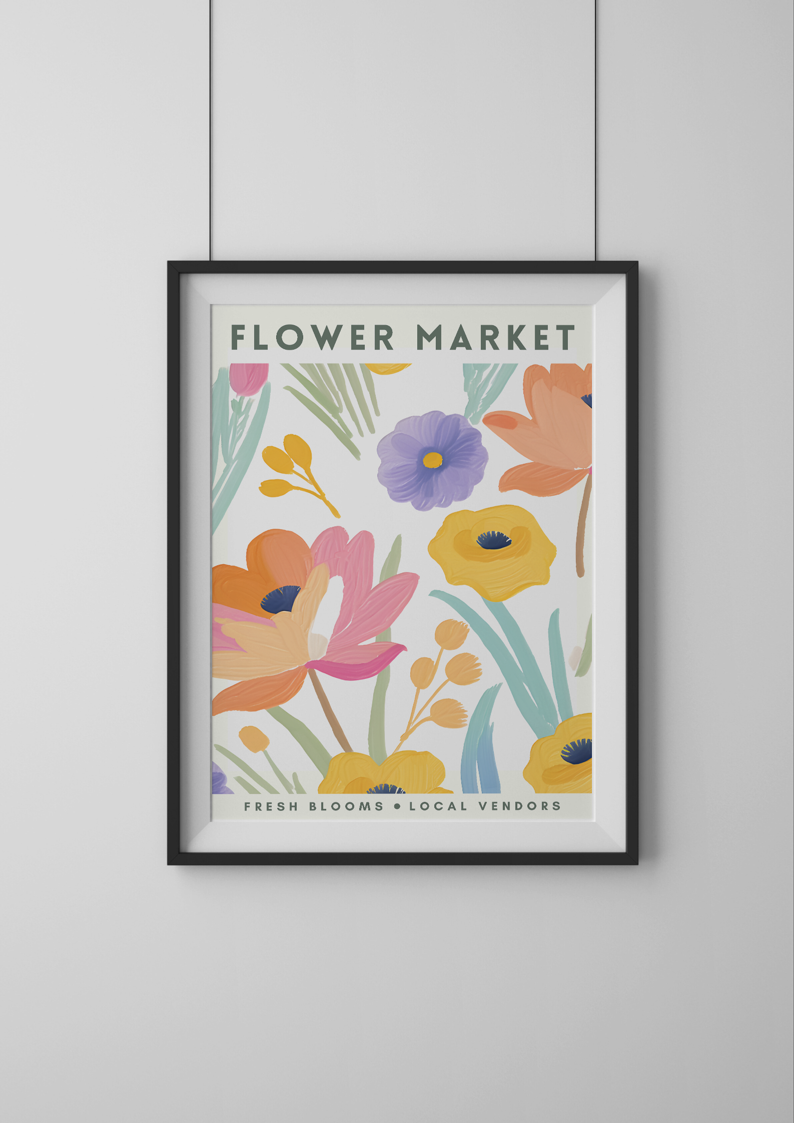 Framed artwork with colorful floral design and 'Flower Market' text on a white wall.