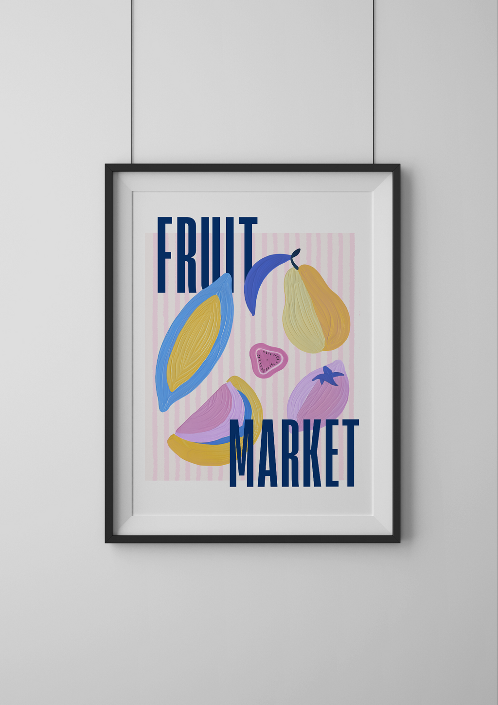 Framed artwork with colorful fruit illustrations and 'Fruit Market' text on a light gray wall.