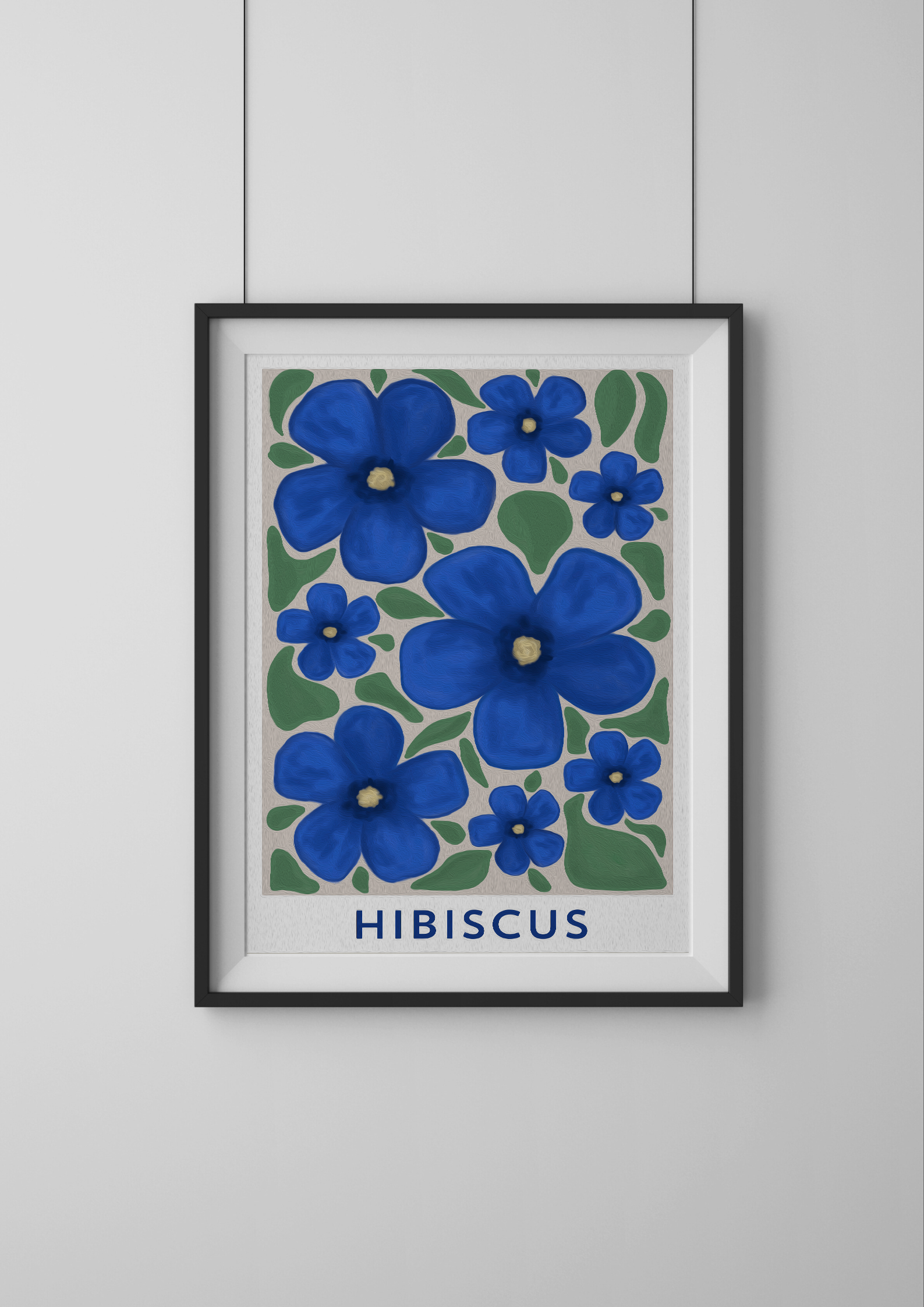 Framed artwork of blue hibiscus flowers on a white wall