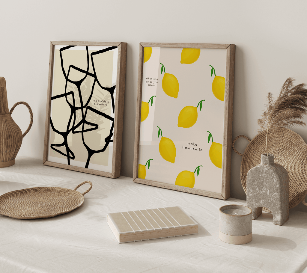 Two kitchen prints leaning against against a wall surrounded by decorative boho items. 