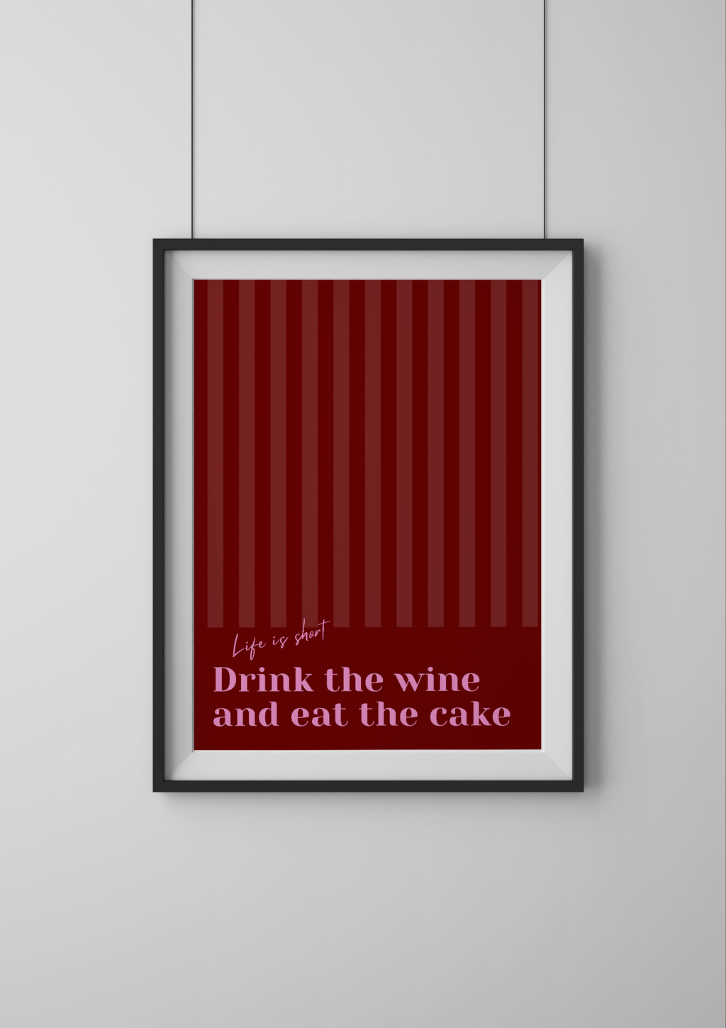 Framed red poster with text on a white wall
