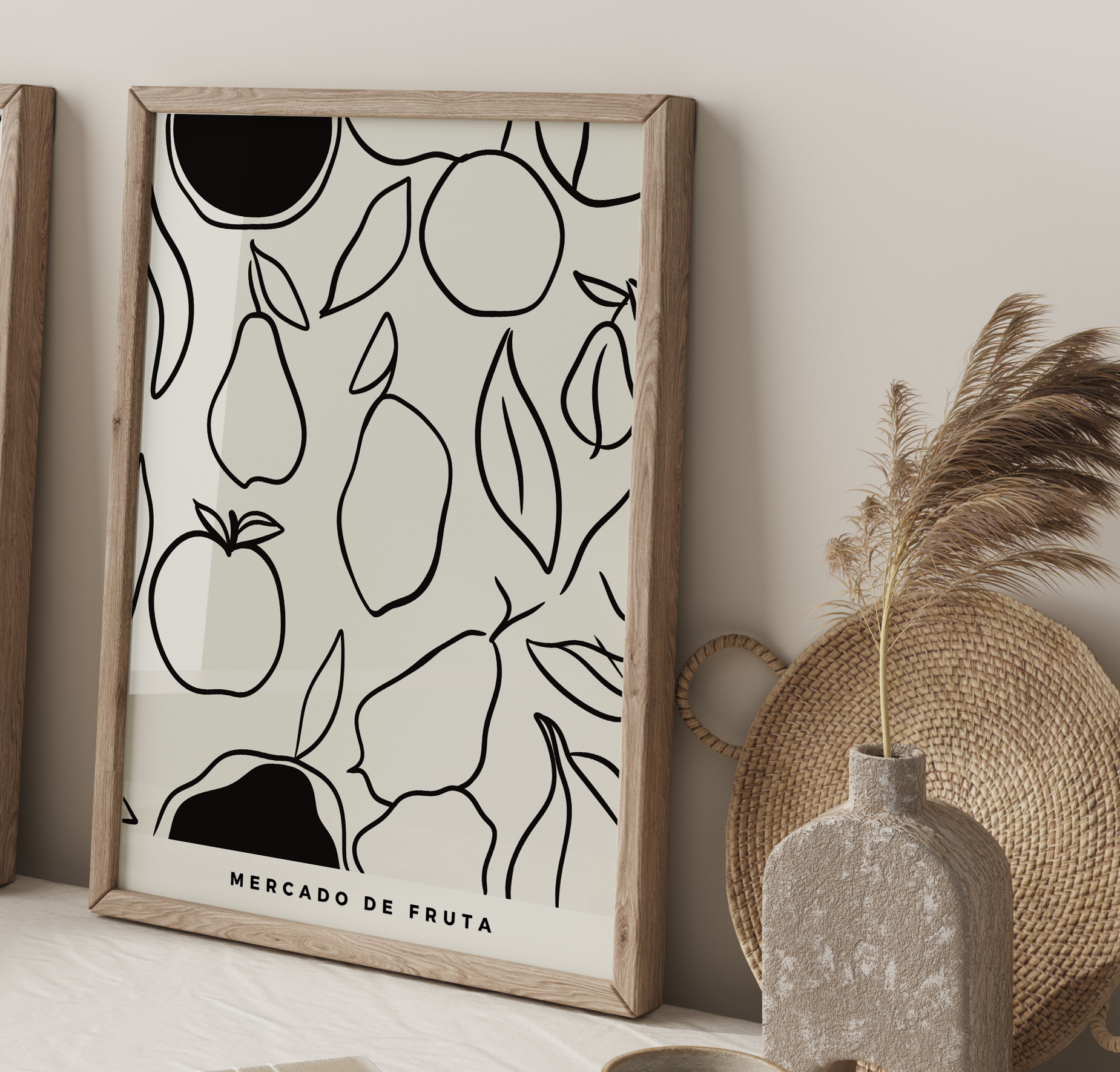 Framed artwork with fruit pattern on a wall next to decorative items