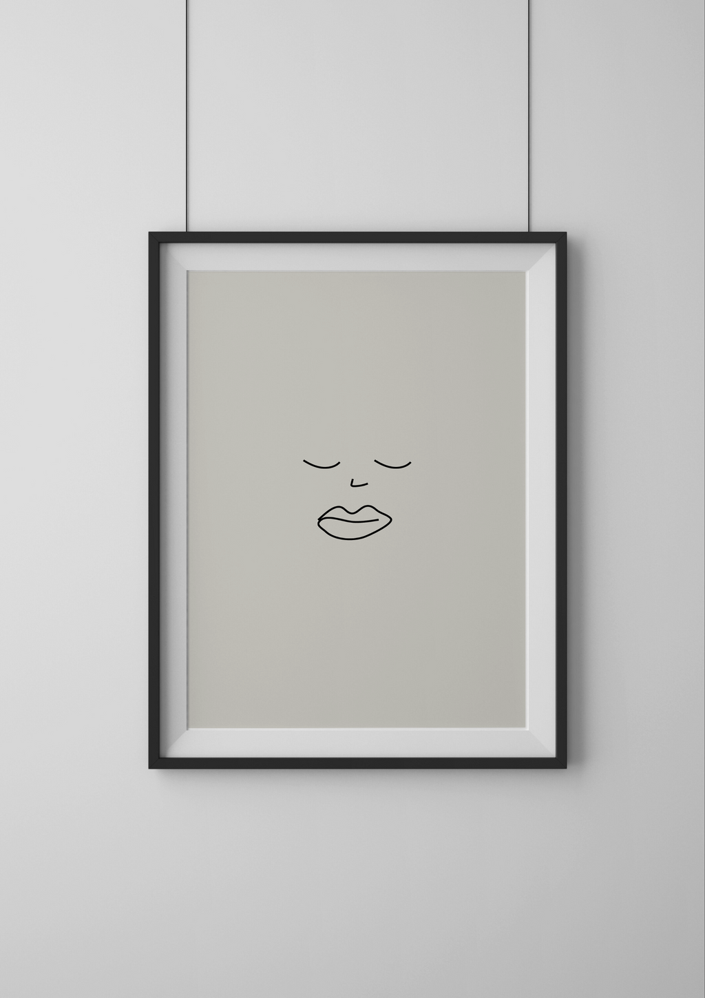 Framed minimalist line art of a face on a light gray background