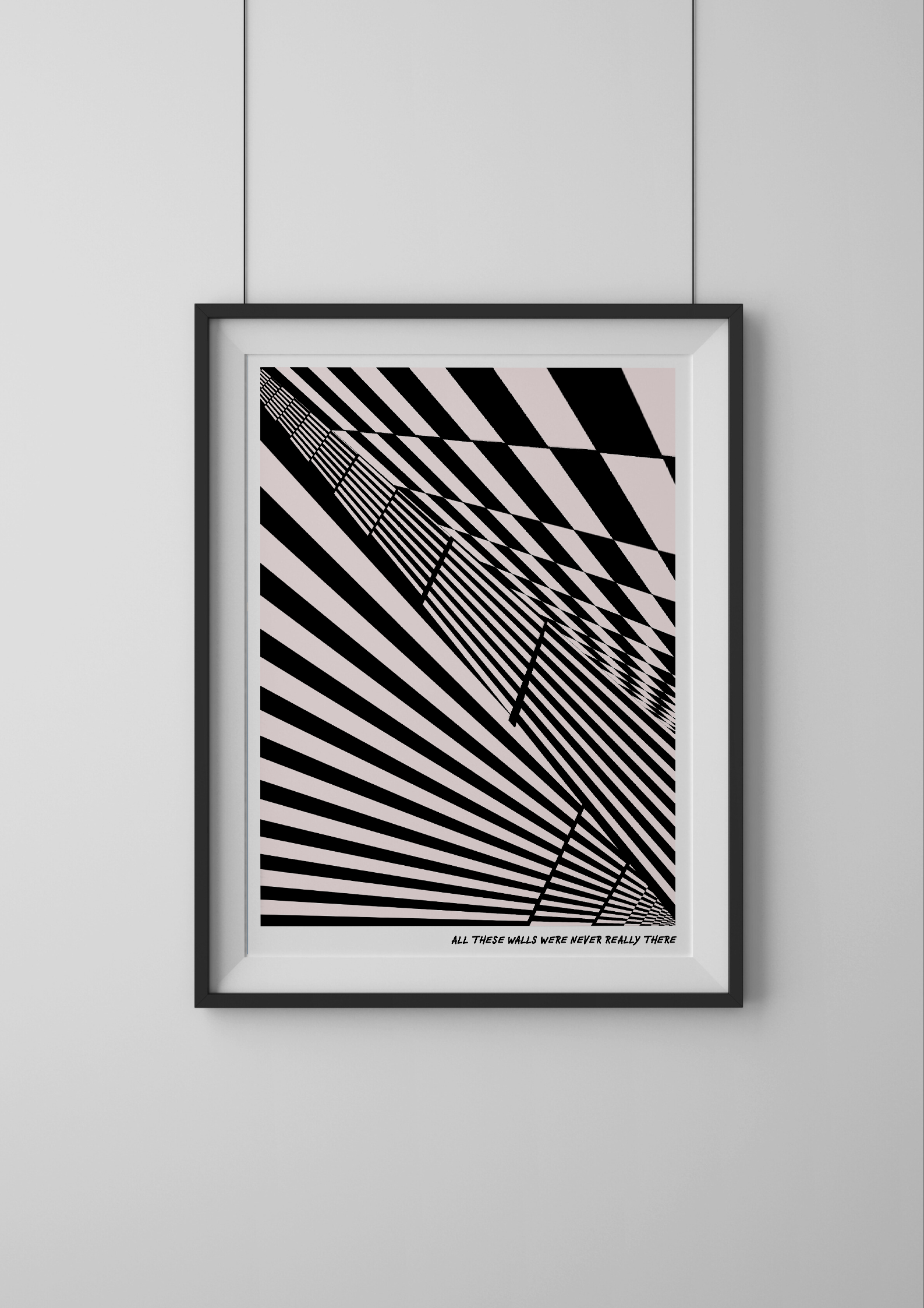Framed black and white abstract art print on a light gray wall