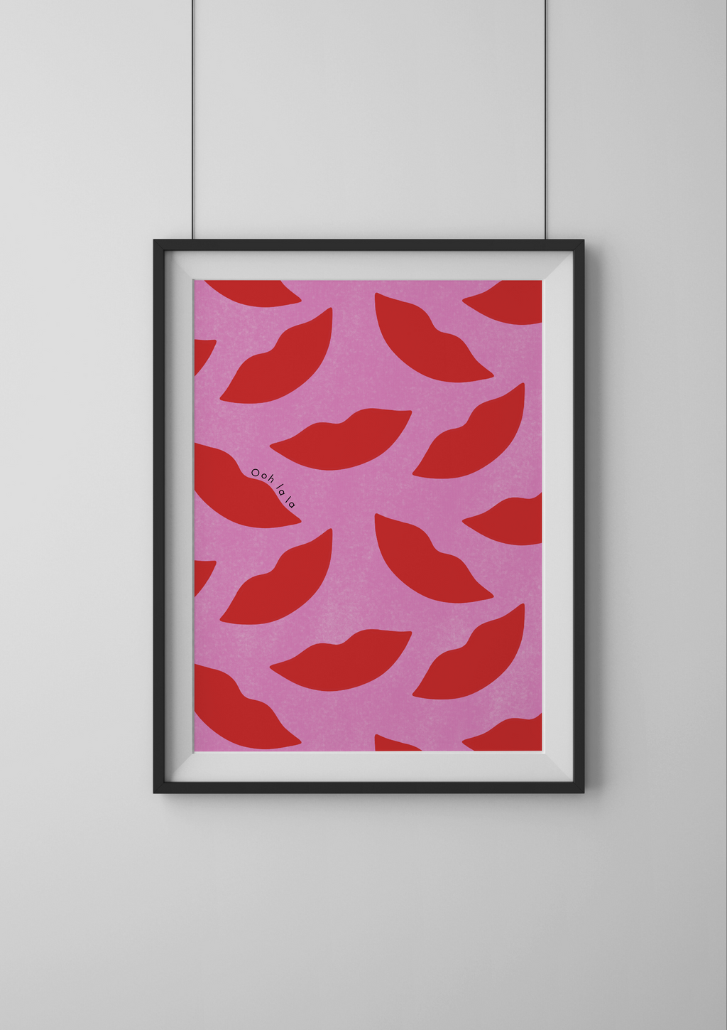 Framed artwork with red lips pattern on pink background