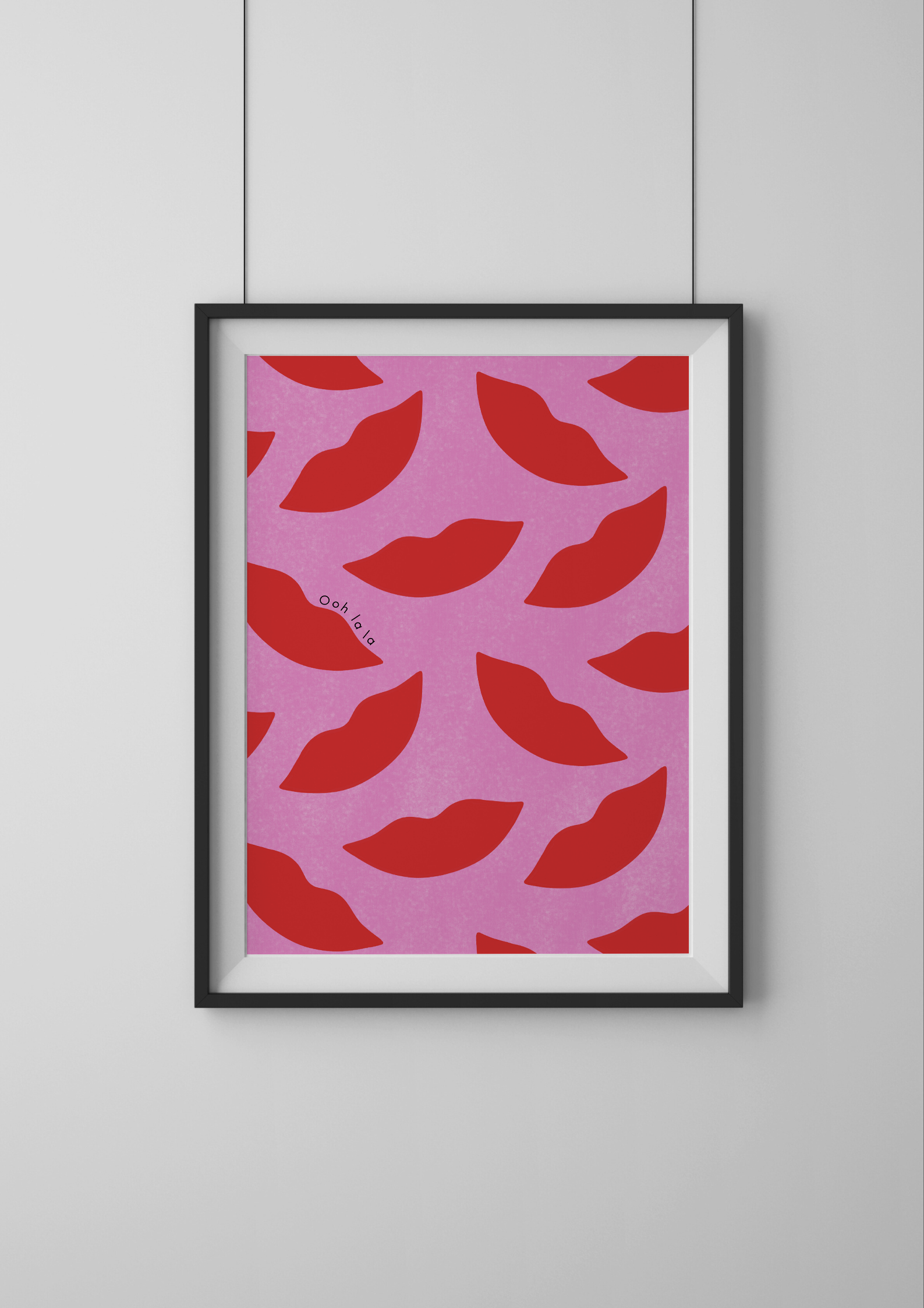 Framed artwork with red lips pattern on pink background