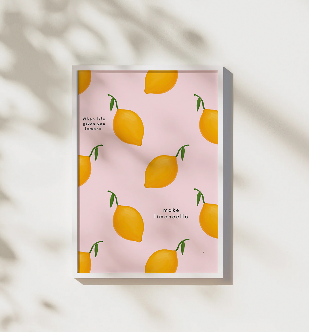 Pink "when life gives you lemons, make limoncello" art print in a wall-hung white frame