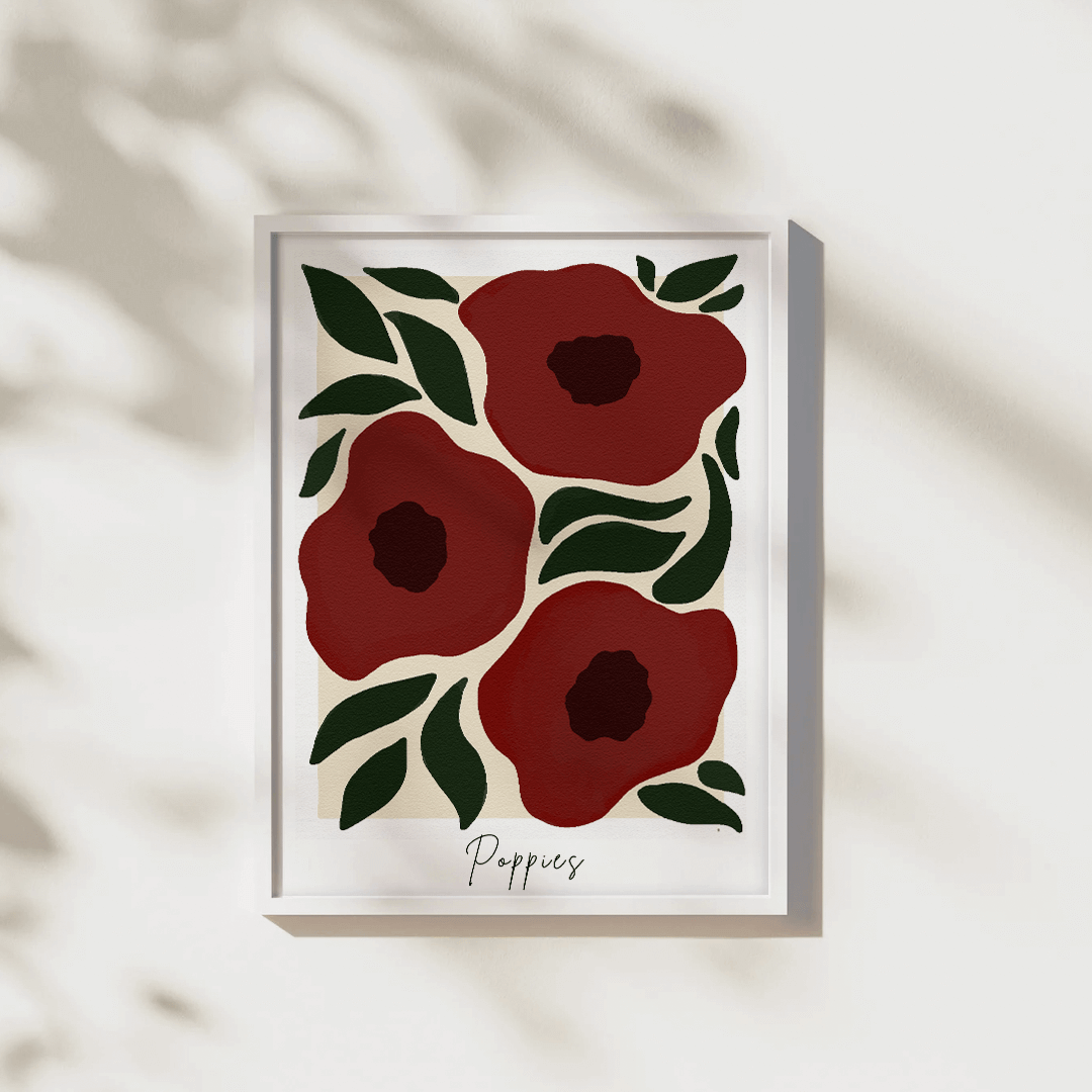 Framed artwork with red poppies and green leaves on a white background