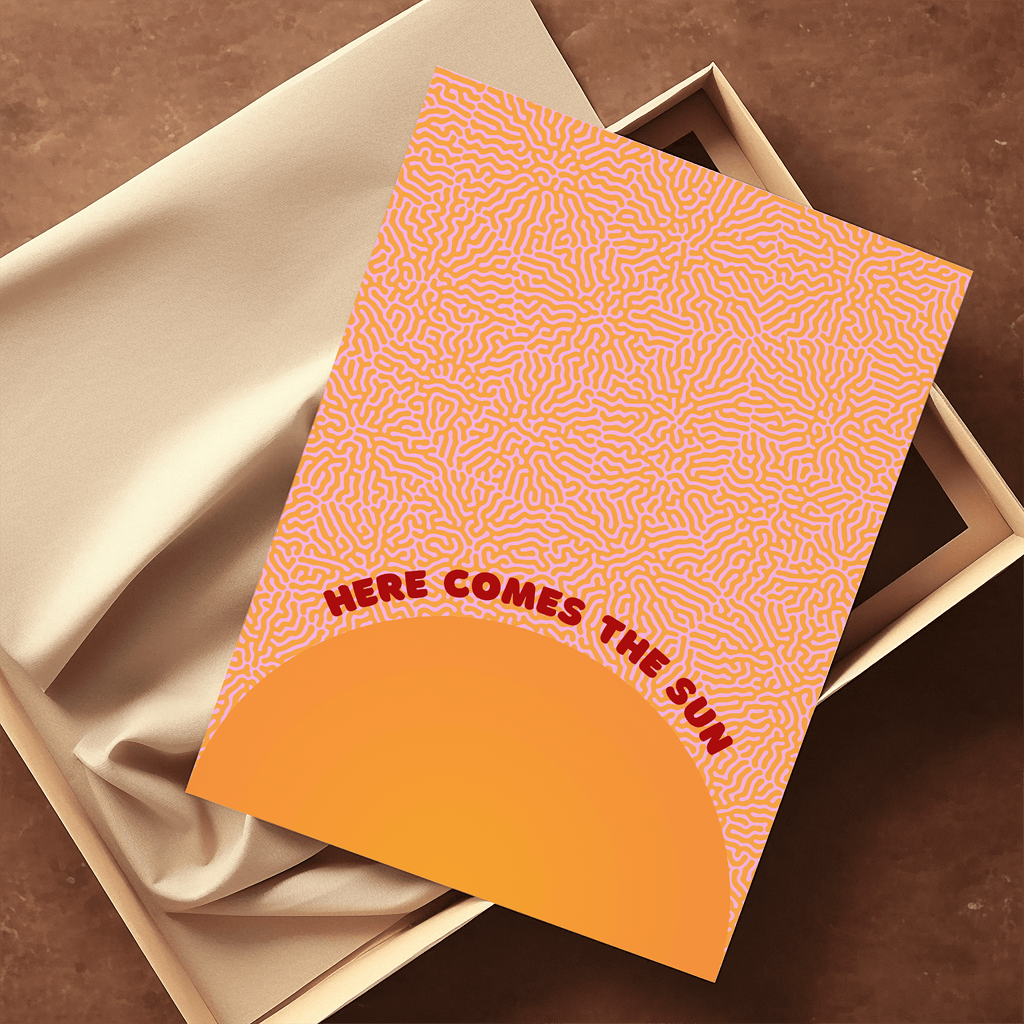 Here comes the sun unframed music art print laying on top of sustainable packaging