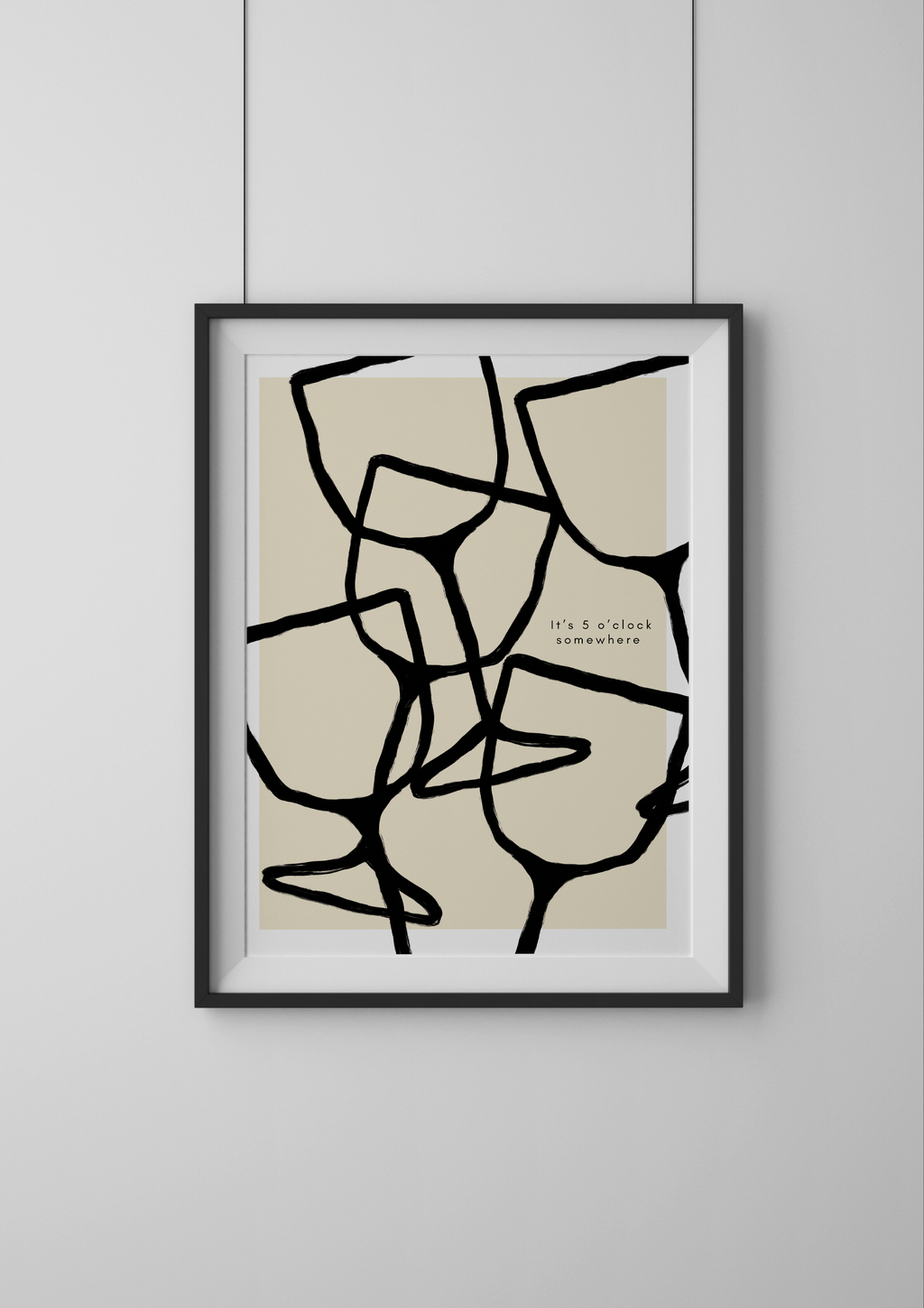 Framed abstract art print on a plain wall
