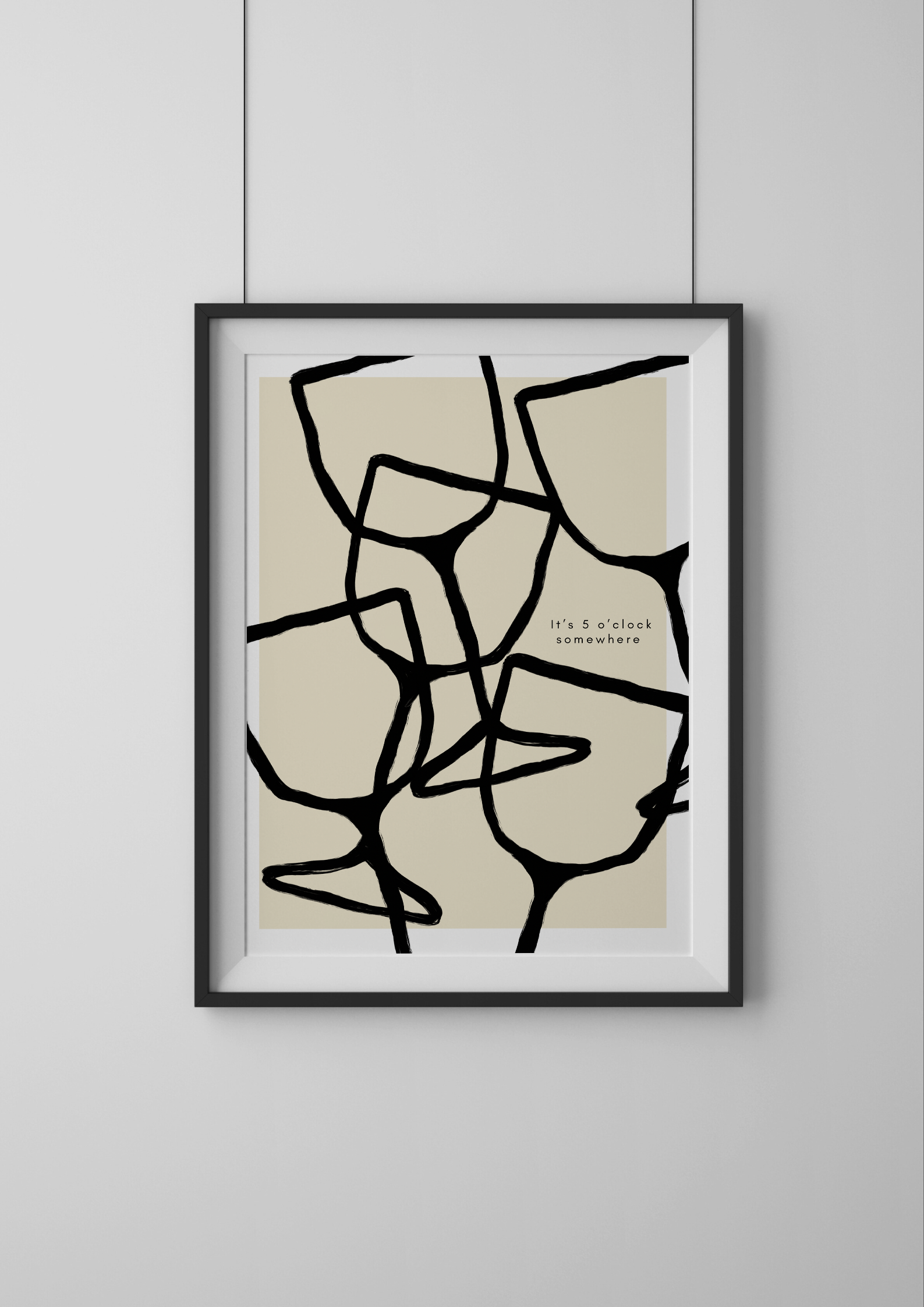 Framed abstract art print on a plain wall