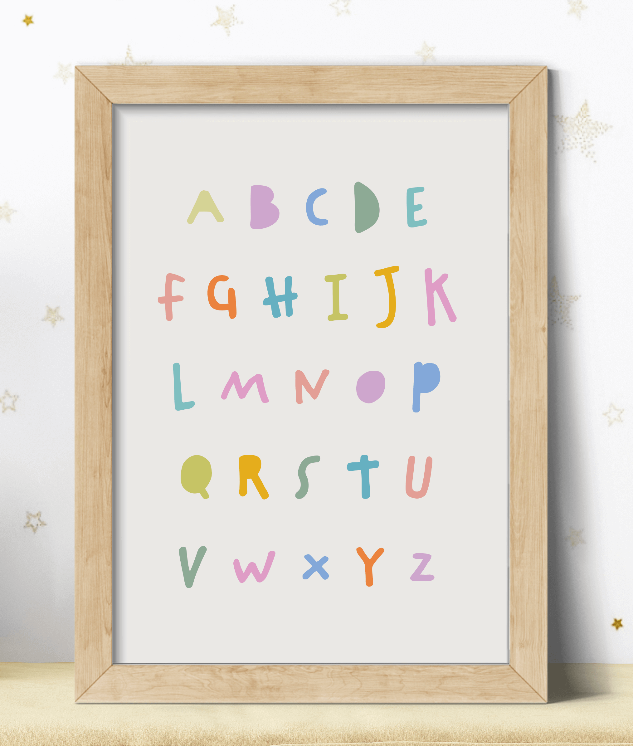 Educational alphabet print for kids nursery in pastel colours against a greige background